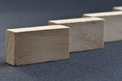 Close-up of of wooden blocks arranged on black table