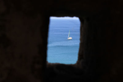 Close-up of sailboat in sea