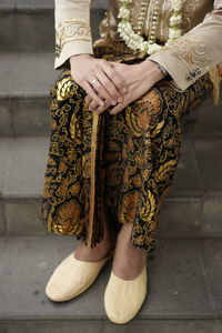 Low section of woman with henna tattoo