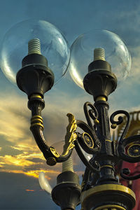 Low angle view of street light against sky