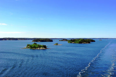 Scenic view of sea against clear blue sky