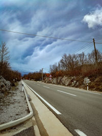 Empty road against sky