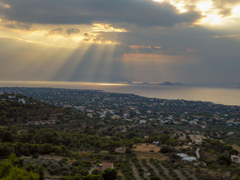 Aerial view of townscape against sky during sunset