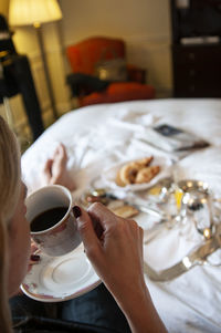 Cropped hand of woman having breakfast