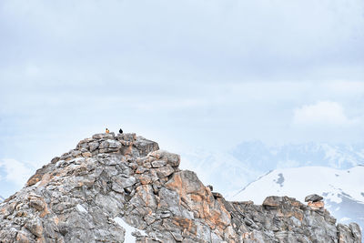 Rock formation on mountain against sky