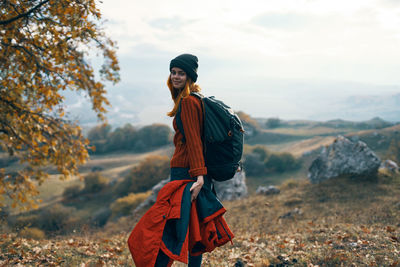 Portrait of smiling young man standing on land