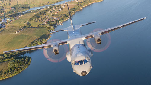 High angle view of airplane flying over land