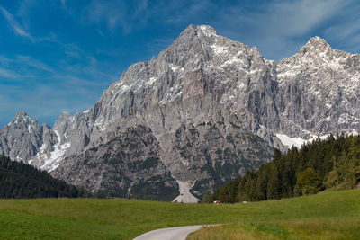 Scenic view of snowcapped mountains against sky