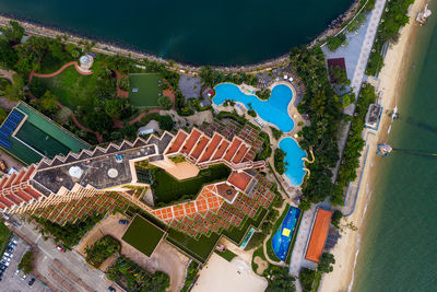 High angle view of buildings by sea against sky