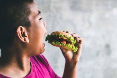 Close-up of man eating food