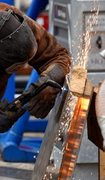 Cropped image of man working in workshop