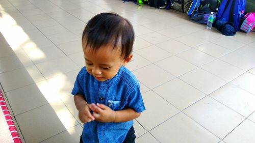 High angle view of cute boy looking down