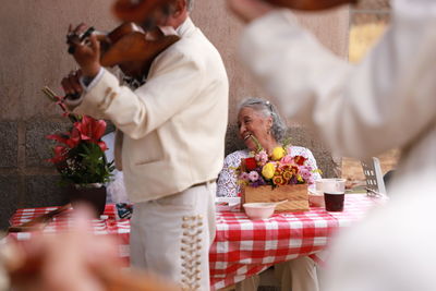 Group of people holding bouquet