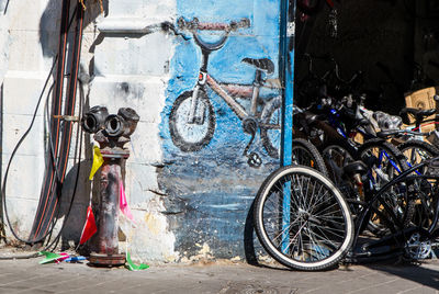 Bicycle parked against building