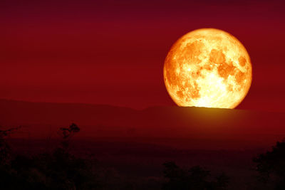 Scenic view of orange sky at night