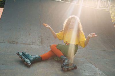 Portrait of smiling woman skating on ramp