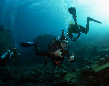 People swimming in sea