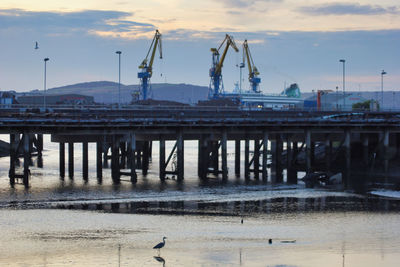 View of pier on water against sky