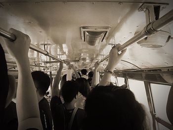 Rear view of people enjoying in bus