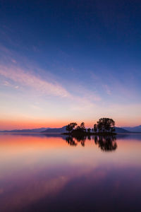 Scenic view of sea against sky at sunset