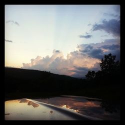 Scenic view of landscape against sky at sunset