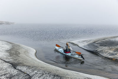 Woman canoeing, sweden