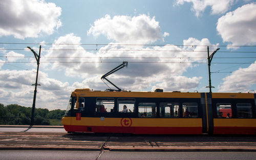 Train on railroad tracks against sky