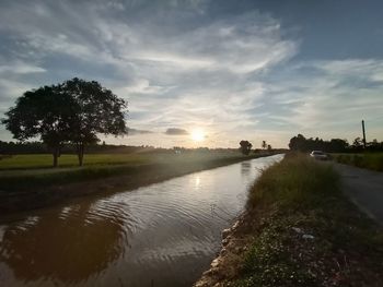 Scenic view of lake against sky during sunset