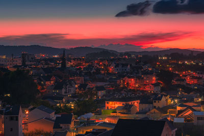 High angle view of illuminated buildings against sky during sunset