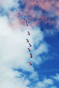 Low angle view of airshow against sky