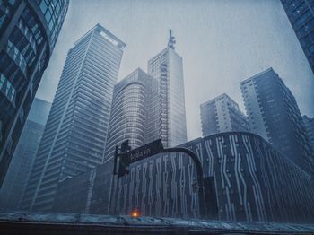 Low angle view of modern buildings in city