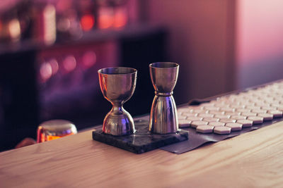 Close-up of wine glasses on table