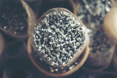 High angle view of nuts and bolts in plastic