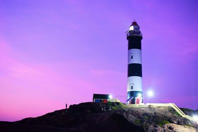 Low angle view of lighthouse against sky during sunset