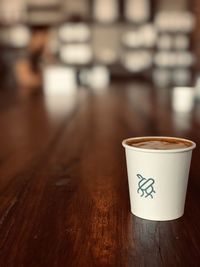 Close-up of coffee cup on table