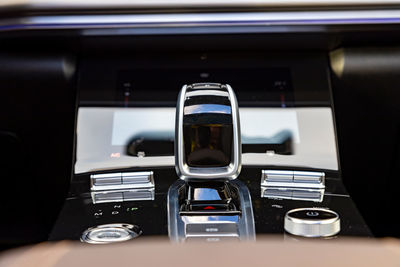 Close-up of gear stick in car