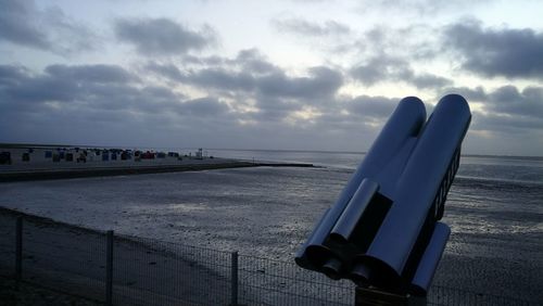 Scenic view of beach against sky during sunset