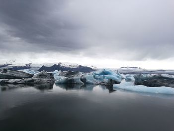 Scenic view of frozen lake against sky