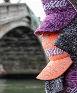 Rear view of woman standing against blurred background