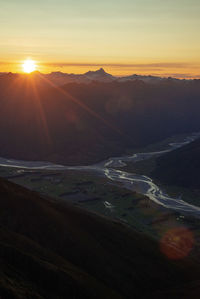 Scenic view of mountains against sky during sunset