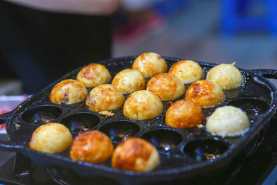 Takoyaki being prepared in ho thi ky street food, ho chi minh city