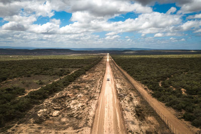 Empty road along countryside landscape