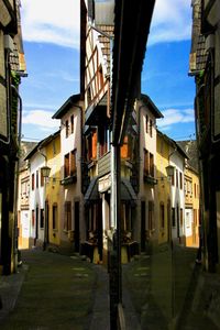 Narrow street amidst buildings in town