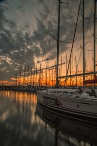 Boat in sea at sunset