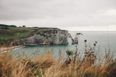 Scenic view of sea and cliff