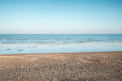 Scenic view of sea against clear sky