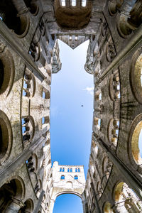 Low angle view of jumieges abbey against sky