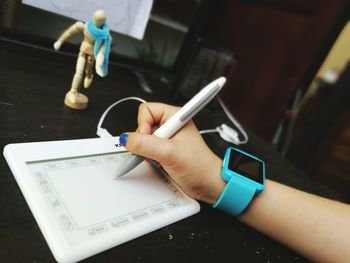 Cropped image of woman holding hands