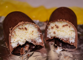 Close-up of halved coconut chocolate on wrapper