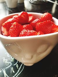 High angle view of strawberries in bowl on table